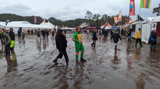 Bring your gumboots: Punters tackle wet conditions.