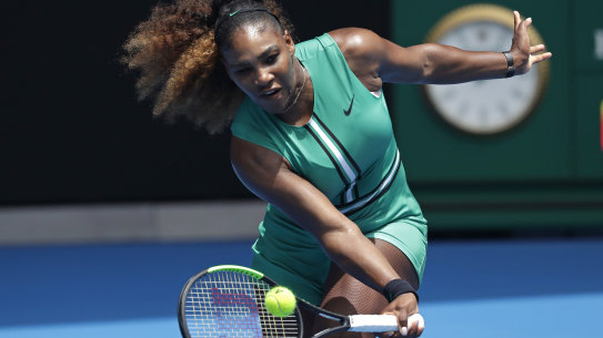 Serena Williams hits a forehand return to Germany's Tatjana Maria during their first round match at the Australian Open tennis championships in Melbourne, Australia, Tuesday, January 15, 2019