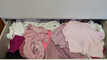 Having shirts folded the standard way in piles wasn't functional and ended up in a mess trying to find specific tops.