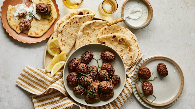 Beef koftas with pita bread and minted yoghurt.