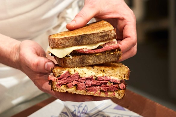 The Reuben sandwich features house-made pastrami.