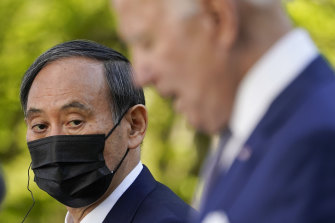 Japanese Prime Minister Yoshihide Suga listens as President Joe Biden speaks at a news conference in the Rose Garden of the White House on April 16, 2021. 
