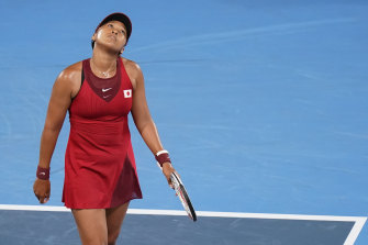Naomi Osaka, of Japan, reacts during a third round women’s tennis match against Marketa Vondrousova, of the Czech Republic, at the Tokyo Olympics.