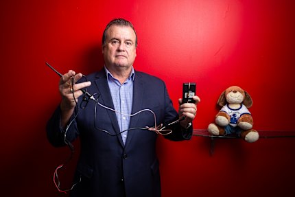Former policeman Stephen Wilson, who helps family violence survivors debug their online accounts, cars and homes, shows examples of devices Protective Group has found (including a toy in which a device was hidden).