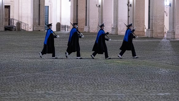 Soldiers march in the courtyard of the Quirinale presidential palace prior to the arrival of Mario Draghi, in Rome, on Friday.
