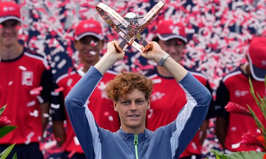 Sinner holds aloft the Toronto Masters title after he beat Australia’s Alex de Minaur.
