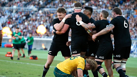Familiar sight: The All Blacks score in Yokohama last year.