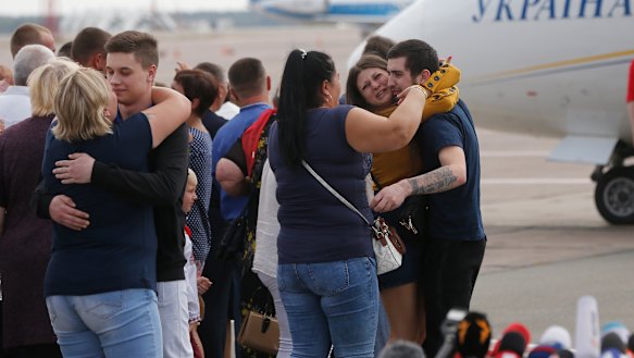 Relatives of Ukrainian prisoners freed by Russia greet them upon their arrival un Ukraine.