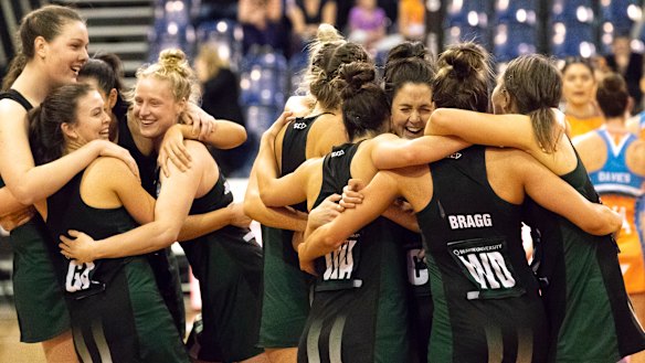 Tasmanian players celebrate their win.