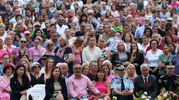 Hannah Clarke's parents, Lloyd and Suzanne (front, centre), are flanked by Premier Annastacia Palaszczuk and Police Commissioner Katarina Carroll at Sunday's vigil to remember their murdered daughter and grandchildren.