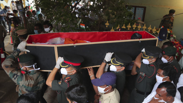 Indian army officers carry the coffin of Colonel B. Santosh Babu for his funeral in Suryapet, about 140 kilometres from Hyderabad. Babu was killed in Monday's clashes.
