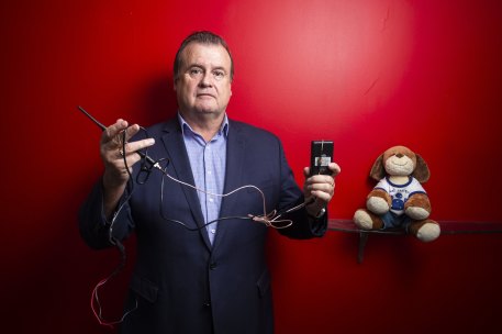 Former policeman Stephen Wilson, who helps family violence survivors debug their online accounts, cars and homes, shows examples of devices Protective Group has found (including a toy in which a device was hidden).