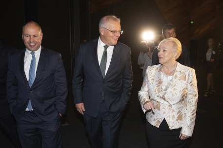 Former treasurer Josh Frydenberg and then-prime minister Scott Morrison with Karyn Sobels in 2021.