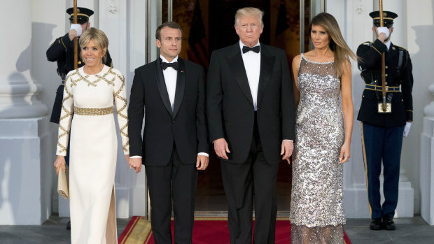 First Lady Melania Trump (right) in Chanel, while French First Lady Brigitte Macron chose Louis Vuitton for the state dinner between the leaders of the two countries.