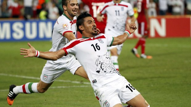 Gucci man: Reza Ghoochannejhad celebrates after scoring for Iran at the 2015 Asian Cup in Australia. He could be back in the country soon if his proposed deal with Sydney FC is completed.