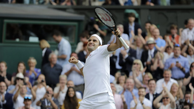 Roger Federer celebrates defeating Rafael Nadal during their semi-final.