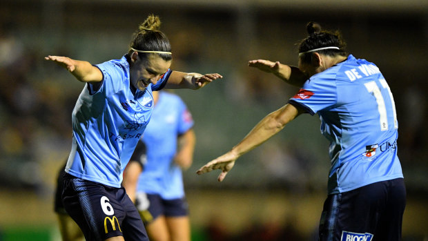 Victory dance: Chloe Logarzo celebrates a goal in the W-League with Lisa De Vanna.