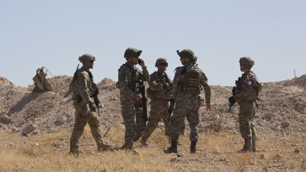 Turkish forces during a joint ground patrol with US forces on the Syrian side of the border with Turkey, near Tal Abyad, Syria in September. 