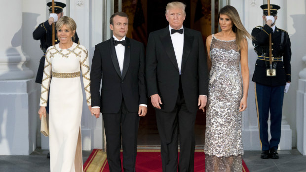 US first lady Melania Trump and French first lady Brigitte Macron attend a state dinner.
