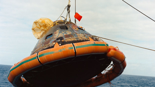 Plenty of friction: The Apollo 11 command module is hoisted from the ocean.