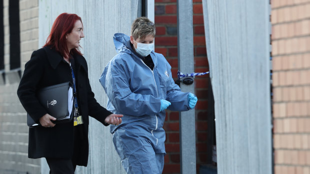 Homicide squad Detective Senior Sergeant Pixie Fuhrmeister (left) at the scene on Friday.