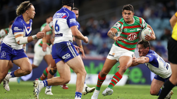 Latrell Mitchell charges through the Bulldogs defence.