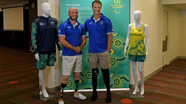 Wheelchair rugby player Chris Bond and paracanoeist Curtis McGrath with some of the new team outfits for the Tokyo 2020 Paralympics. 