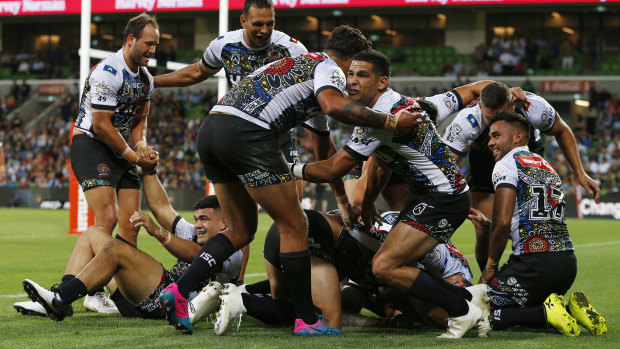 Jubilation: The Indigenous All Stars celebrate after Ferguson's try.