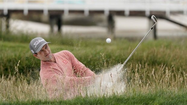 Australia's Adam Scott digs his way out of trouble at this year's US Open.