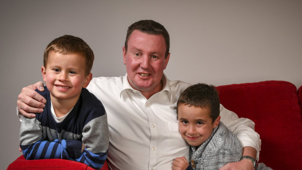 Karl Meban - seen here with his sons Adam and Louis - has dodged the deadly odds of oesophageal cancer.