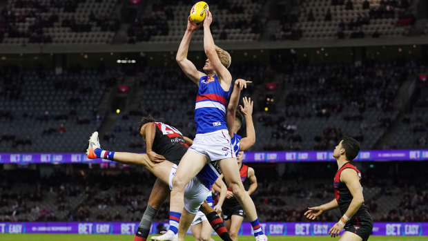 Happy returns: Birthday boy Tim English flies high for the Bulldogs during their round 21 belting of the Bombers.