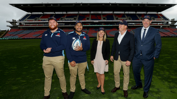 Paul Doorn, far right, with Waratahs staff and players, and a Newcastle councillor, at McDonald Jones Stadium in Newcastle last year.