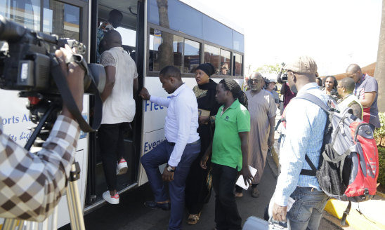 Relatives of the victims board a bus at Jomo Kenyatta International Airport, Nairobi.