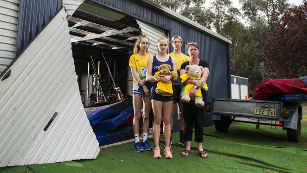 Woden athletics club users Grace Brennan, Caitlin Hanna, Erek Lukowski and Woden Thunder Little Athletics Club Secretary Mel Harding are disappointed to see a shed containing sports equipment at the Woden Athletics Park destroyed due to arson.