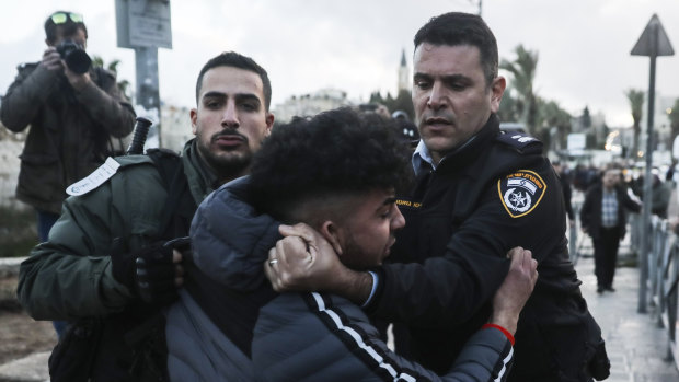 Israeli border police arrests a Palestinian ahead of a protest against Middle East peace plan announced Tuesday by US President Donald Trump.