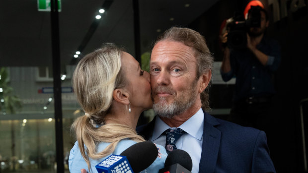 Craig McLachlan is kissed by his partner, Vanessa Scammell, in front of the media in Sydney, after a not guilty verdict was announced in his Melbourne sexual assault case.