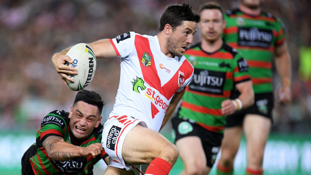 Straight through: Ben Hunt evades a tackle by John Sutton to score.