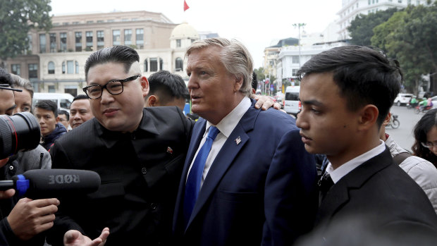 US President Donald Trump impersonator Russell White, centre right, and North Korean leader Kim Jong-un impersonator Howard X.