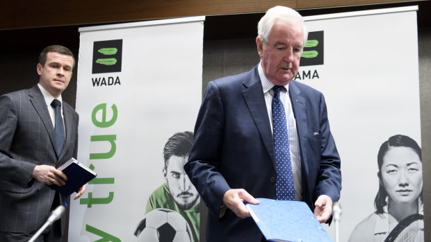 President-elect of WADA Witold Banka and Reedie arrive at the press conference to announces the sanctions.
