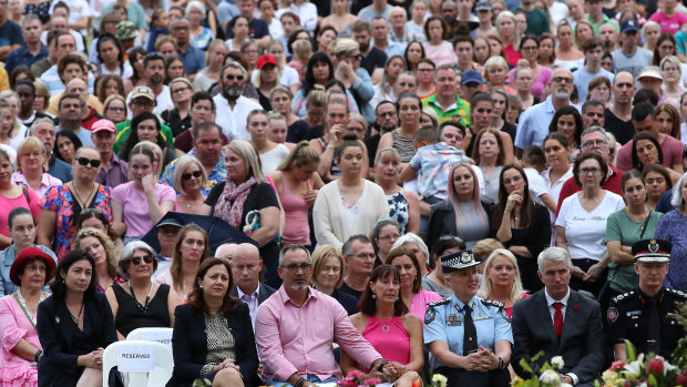 Hannah Clarke's parents, Lloyd and Suzanne (front, centre), are flanked by Premier Annastacia Palaszczuk and Police Commissioner Katarina Carroll at Sunday's vigil to remember their murdered daughter and grandchildren.