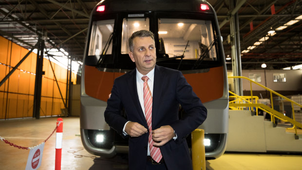 Transport Minister Andrew Constance in front of a mock of one of the new intercity trains.