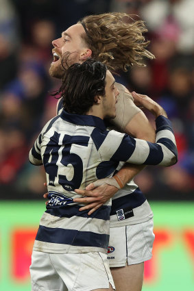 Cam Guthrie celebrates a goal with Brad Close.