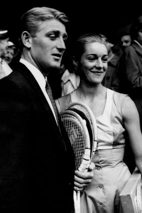 
Reigning champion, Lew Hoad, arrives at Wimbledon with his wife, June 24, 1957. 