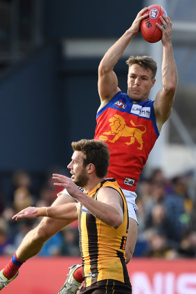 Lincoln McCarthy of the Lions marks against the Hawks in Launceston.