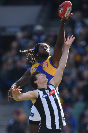 Tapped out: Nic Nat goes up against Collingwood\'s Brody Mihocek before being sidelined by knee injury.