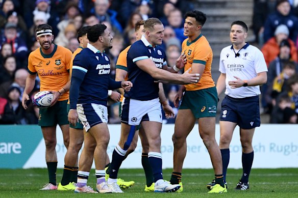 Joseph-Aukuso Suaalii and Sione Tuipulotu trade words at Murrayfield.
