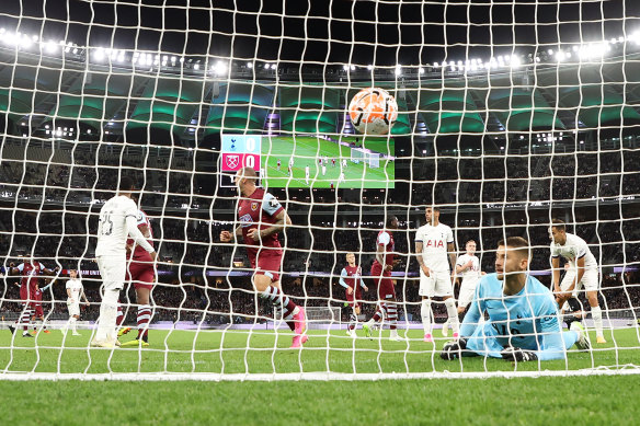 Guglielmo Vicario of Hotspur looks on after Danny Ings of West Ham scores a goal.