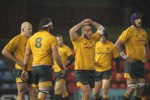 Dan Palmer (centre) turns out for the Wallabies against Scotland in 2012.