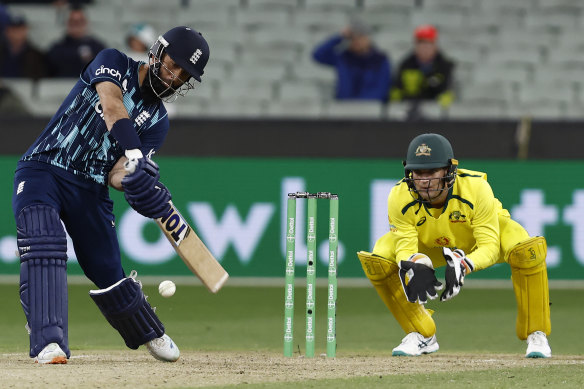 England’s Moeen Ali hits the ball into the air.