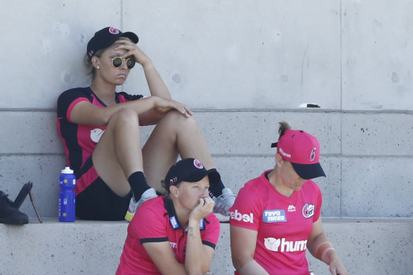 Ash Gardner nurses a sore head after being forced out of the WBBL match against Adelaide at Drummoyne Oval.